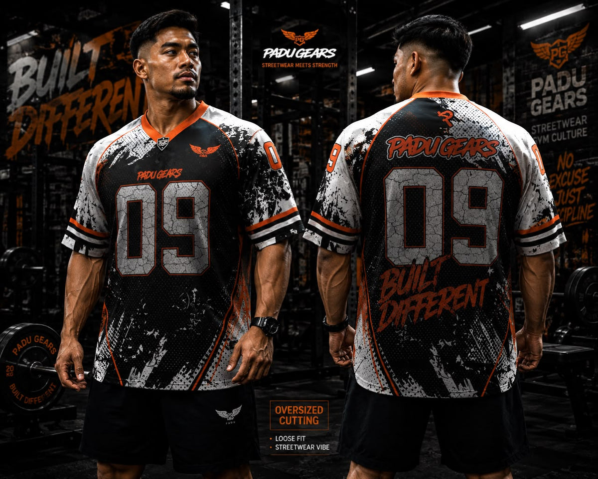 Front and back views of models wearing the Built Different orange oversized jersey
